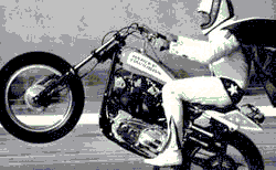 Evel Knievel popping a wheelie.